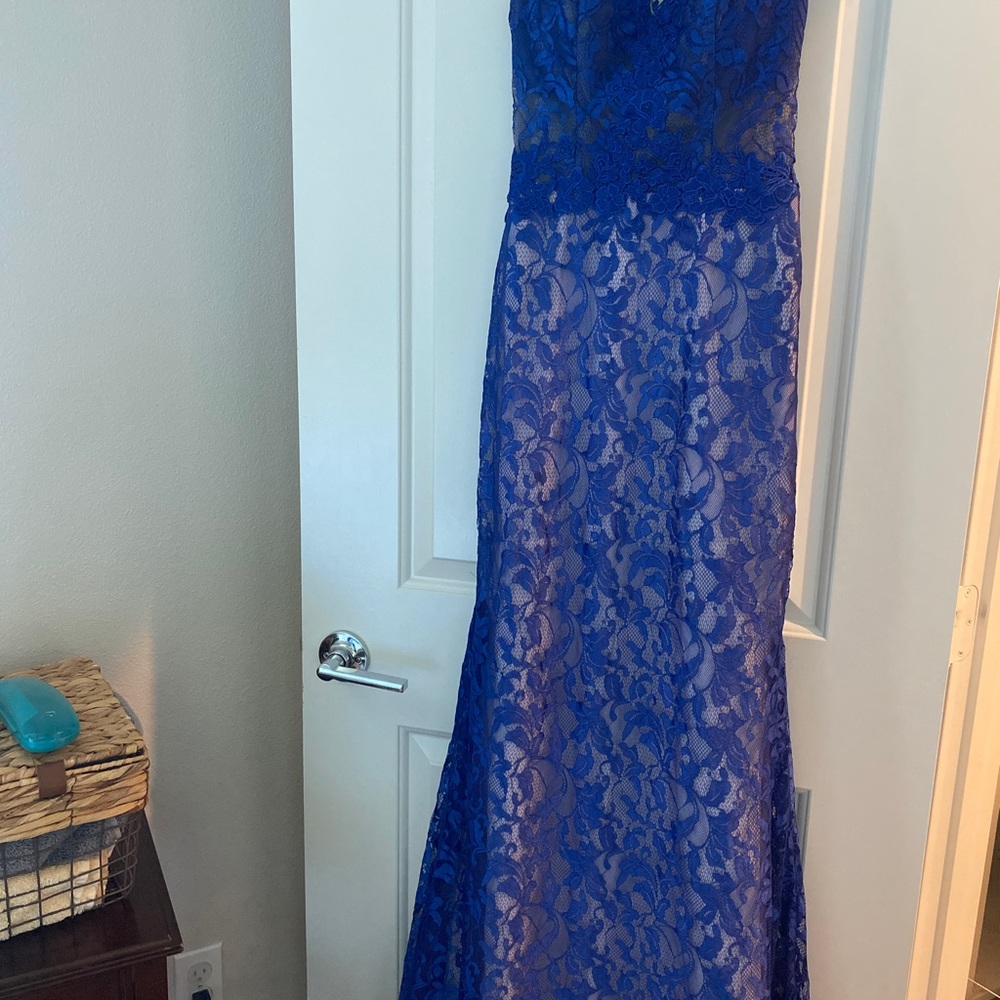 Floor length embroidered dress. V neck with low back